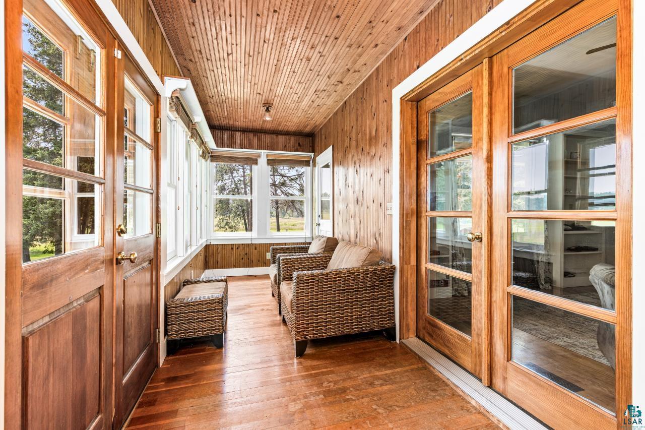 33415 Jackson Road Askov, MN 55704 - Photo 28 of 91 Sunroom / solarium with a sauna / steam room, wood-type flooring, wooden walls, wood ceiling, and french doors