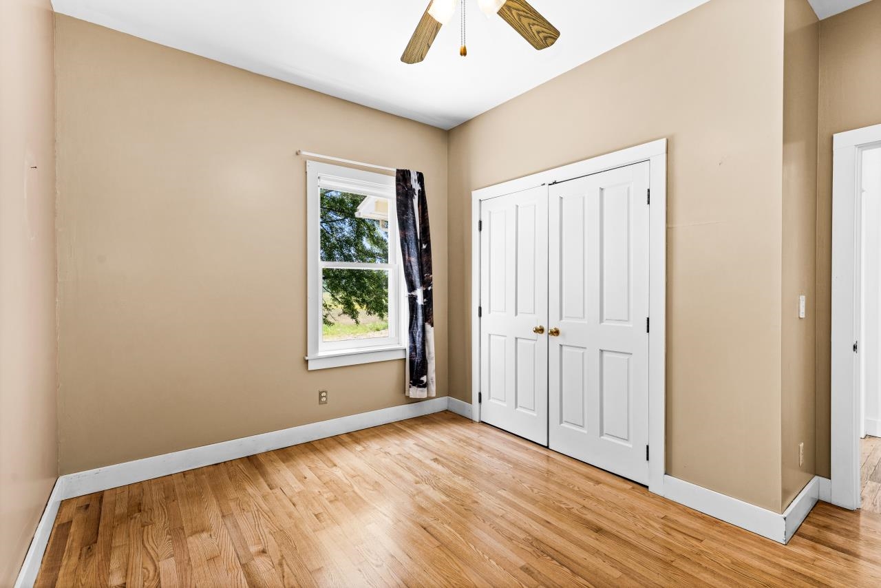 33415 Jackson Road Askov, MN 55704 - Photo 44 of 91 Unfurnished bedroom featuring light wood-type flooring, a closet, and ceiling fan