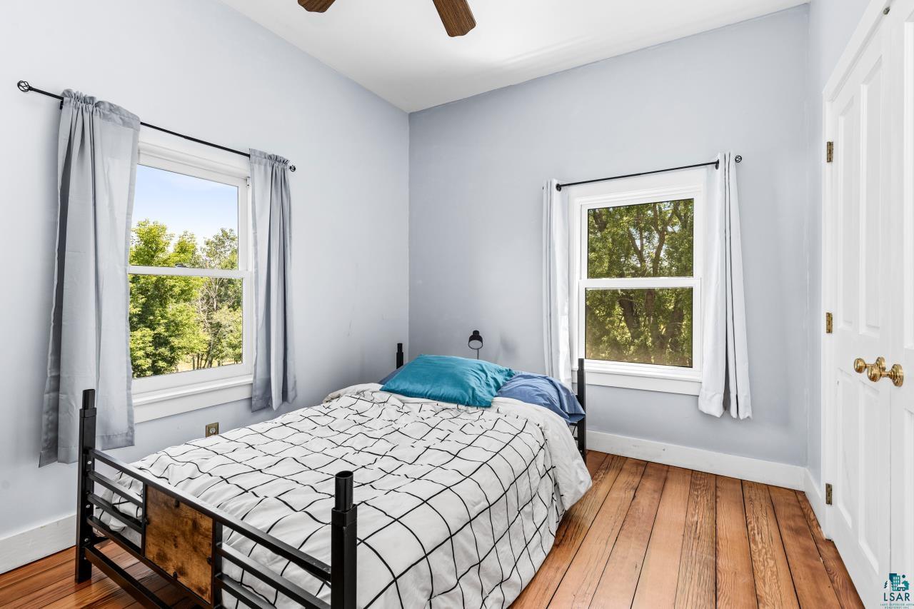 33415 Jackson Road Askov, MN 55704 - Photo 49 of 91 Bedroom featuring hardwood / wood-style floors and a ceiling fan