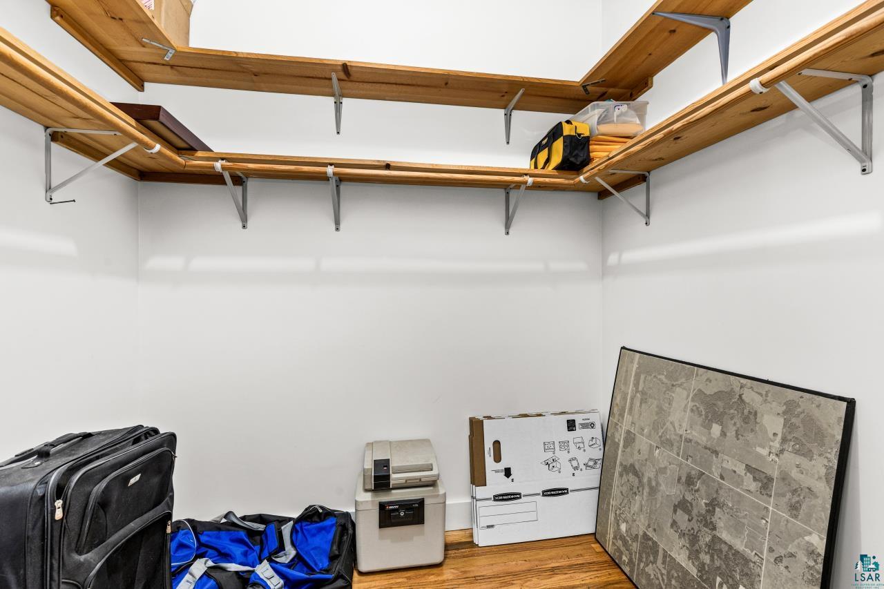 33415 Jackson Road Askov, MN 55704 - Photo 54 of 91 Walk in closet featuring light wood-style floors