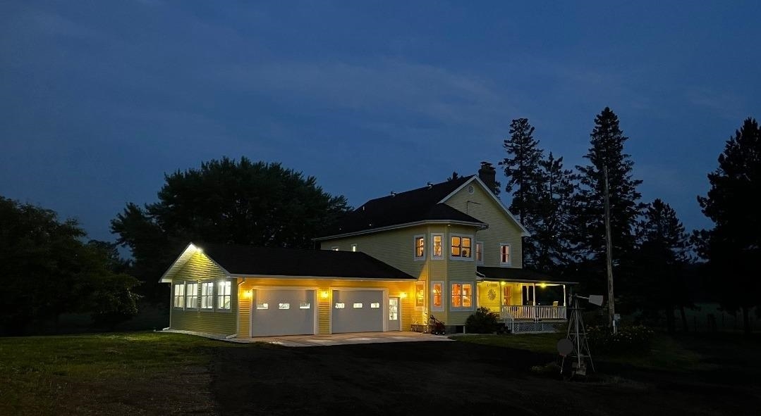 33415 Jackson Road Askov, MN 55704 - Photo 6 of 91 Traditional-style house with a garage, asphalt driveway, a porch, and a lawn