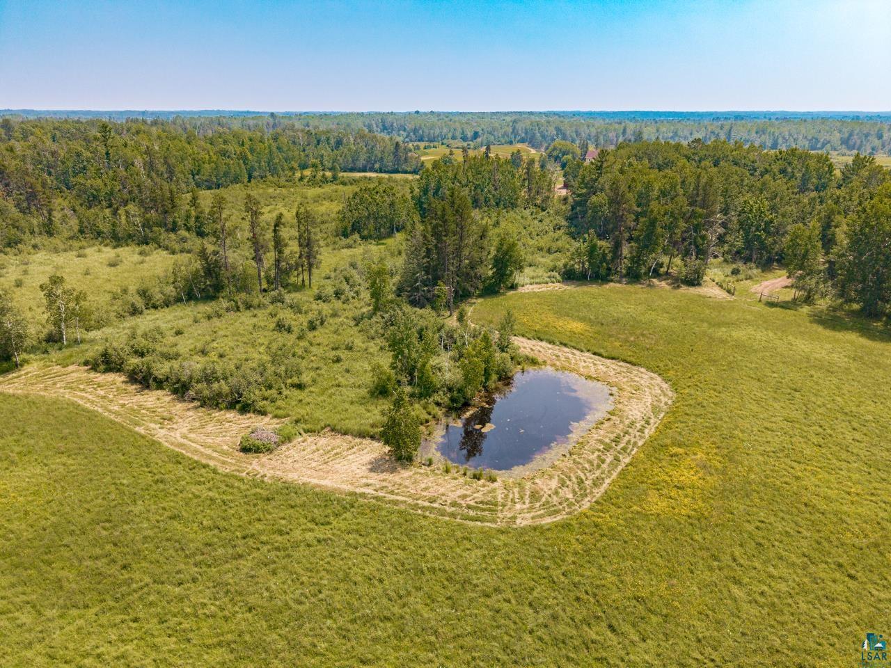 33415 Jackson Road Askov, MN 55704 - Photo 87 of 91 Bird's eye view of a nearby body of water and a heavily wooded area