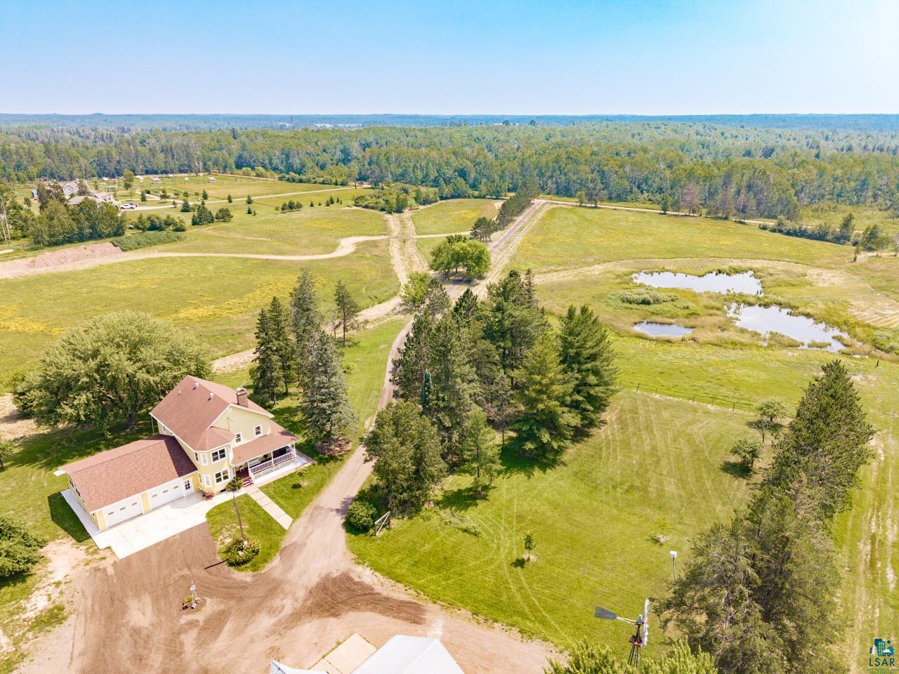 33415 Jackson Road Askov, MN 55704 - Photo 88 of 91 Bird's eye view of a large body of water and a forest
