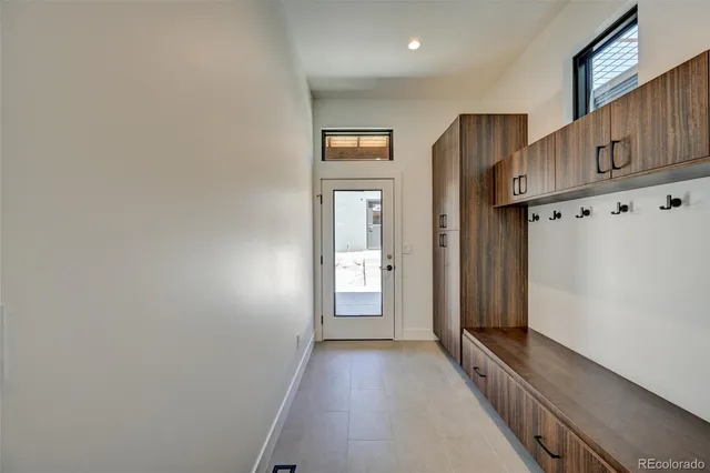 a view of an entryway with wooden floor