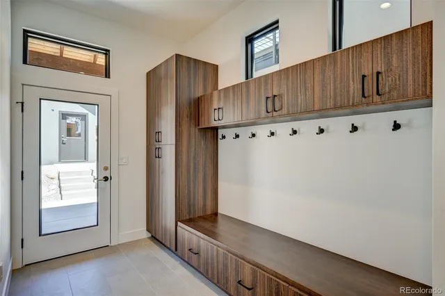 a view of an entryway with wooden floor