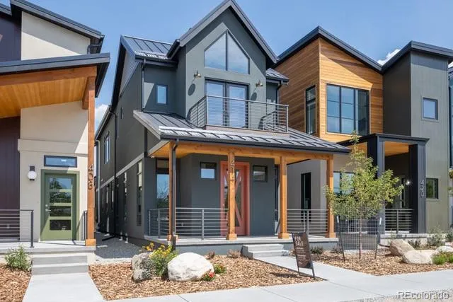 a view of a house with a small yard and plants