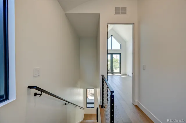 a view of an entryway with wooden floor