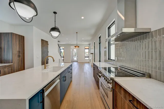 a kitchen with a sink and a stove