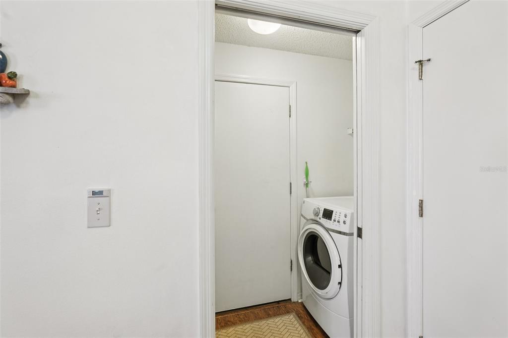 2461 Nantucket Harbor Loop Sun City Center, FL 33573 - Photo 16 of 47 a utility room with dryer and washer