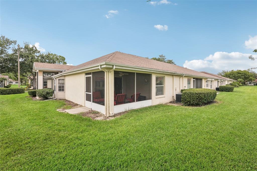 2461 Nantucket Harbor Loop Sun City Center, FL 33573 - Photo 20 of 47 a view of a house with a yard and pathway