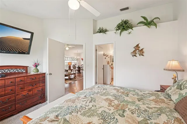 a bedroom with a bed and a television