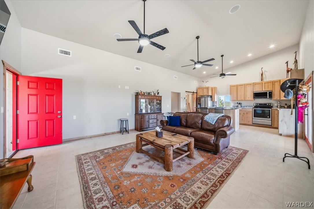 10374 East Happy Trails Road Kingman, AZ 86401 - Photo 11 of 68 a living room with lots of furniture and kitchen view