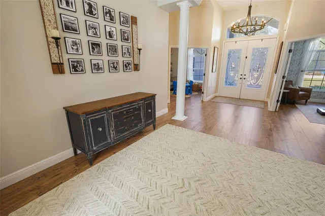 a dining room with furniture and a window