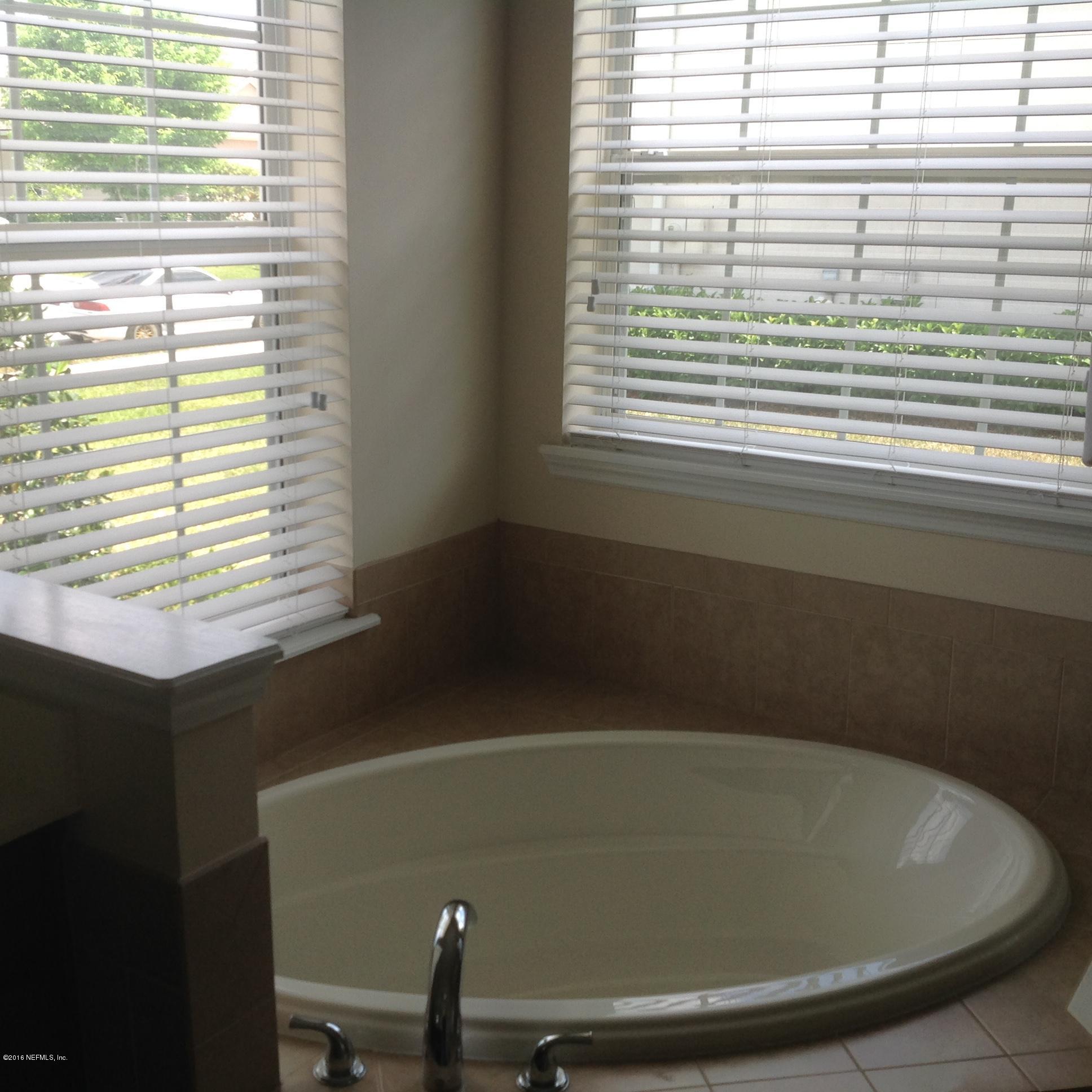 239 Holland Drive St. Augustine, FL 32095 - Photo 20 of 46 a view of a bathtub in a bathroom next