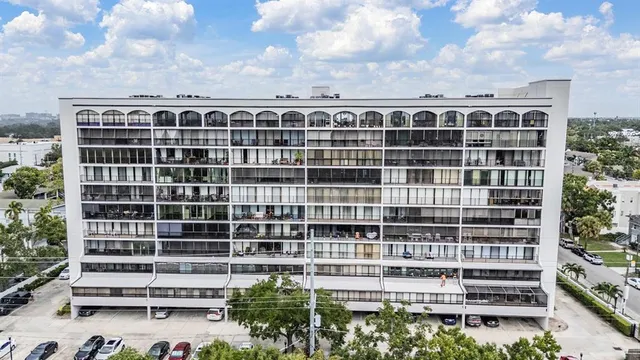 a view of a building with a lot of plants