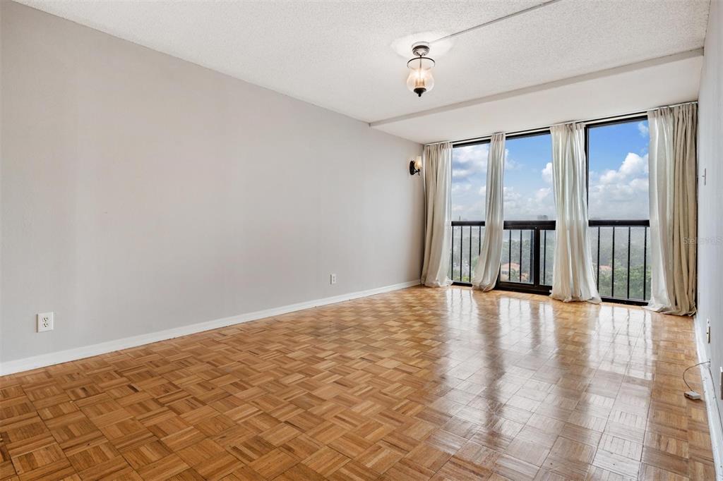 3211 West Swann Avenue, Unit 907 Tampa, FL 33609 - Photo 20 of 32 a view of an empty room with window and stairs