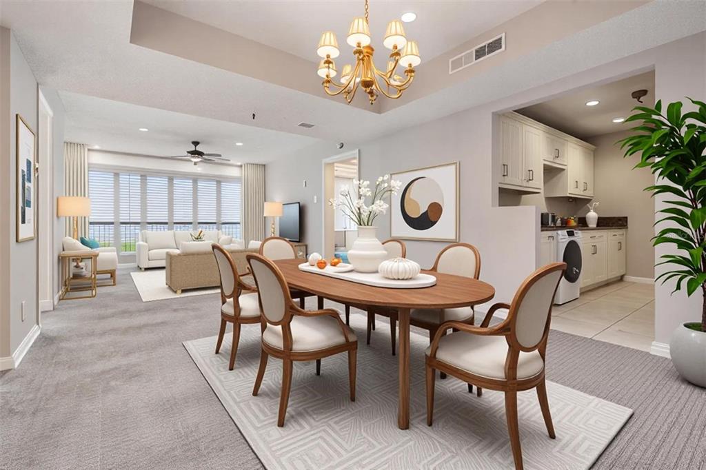 3211 West Swann Avenue, Unit 907 Tampa, FL 33609 - Photo 3 of 32 a view of a dining room and livingroom with furniture a rug a potted plant and a chandelier