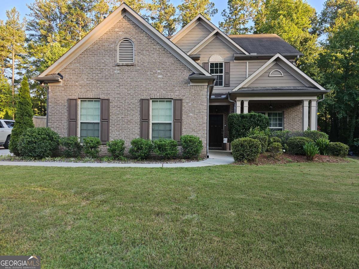 3837 Reece Farms Court Powder Springs, GA 30127 - Photo 1 of 1 a front view of a house with a yard and garage