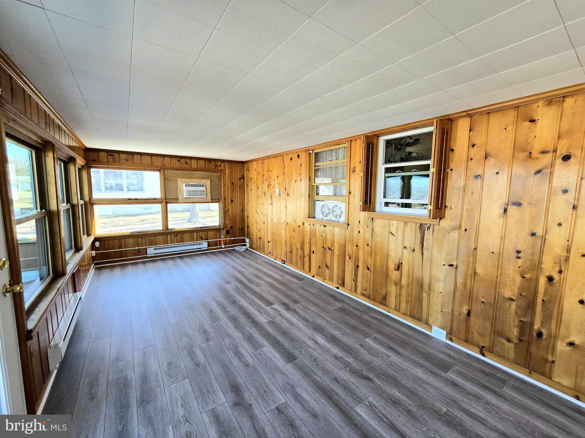 53 Circle Drive Earleville, MD 21919 - Photo 12 of 35 a view of empty room with wooden floor and fan