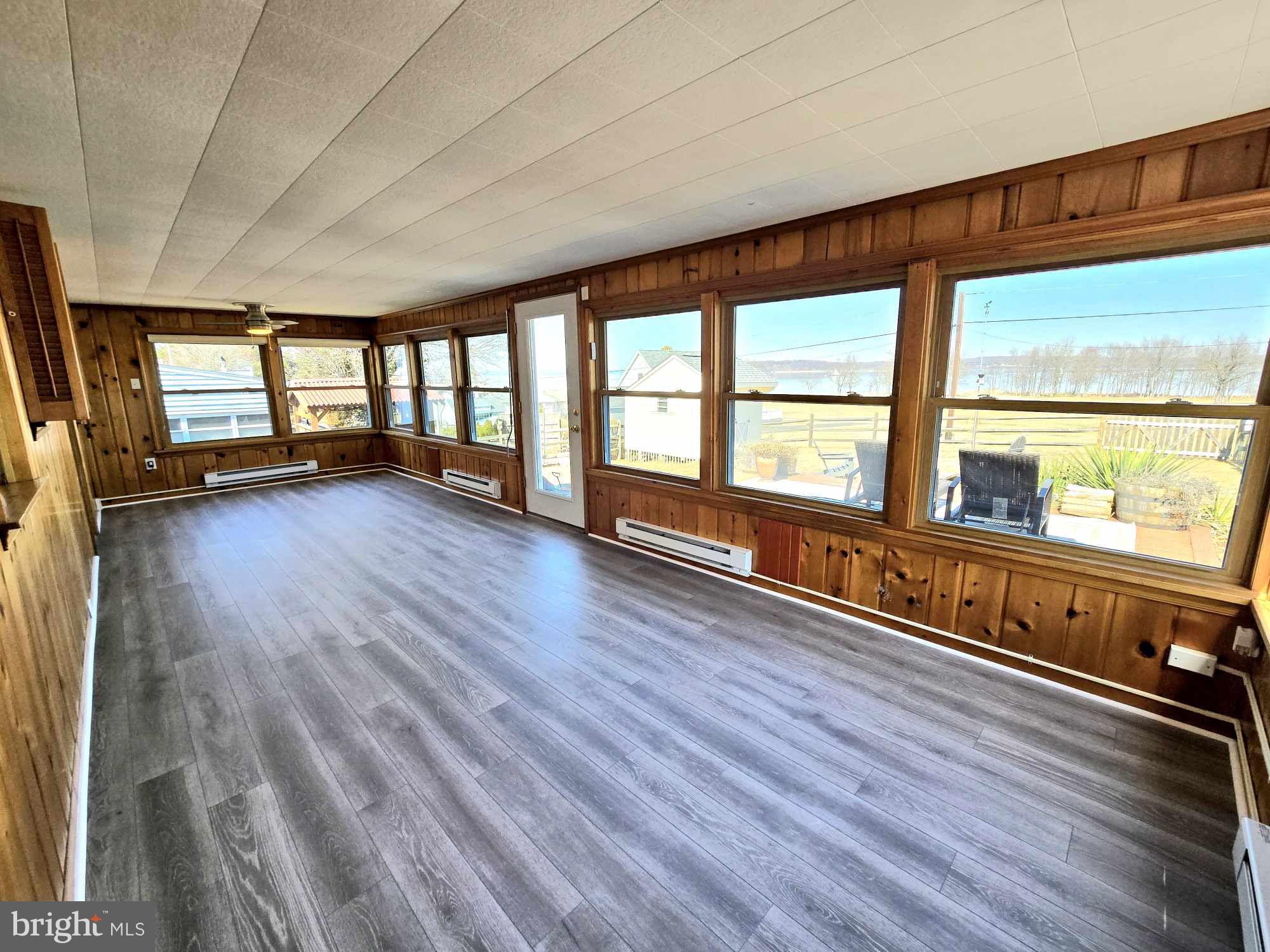 53 Circle Drive Earleville, MD 21919 - Photo 14 of 35 an empty room with wooden floor and windows