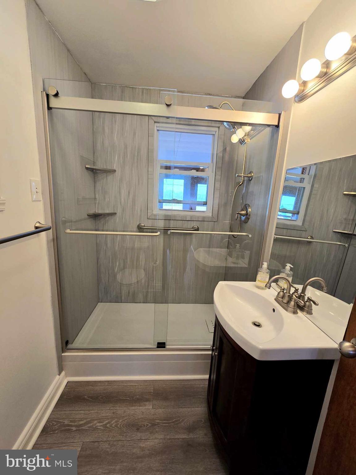 53 Circle Drive Earleville, MD 21919 - Photo 15 of 35 a bathroom with a sink a mirror and a bathtub