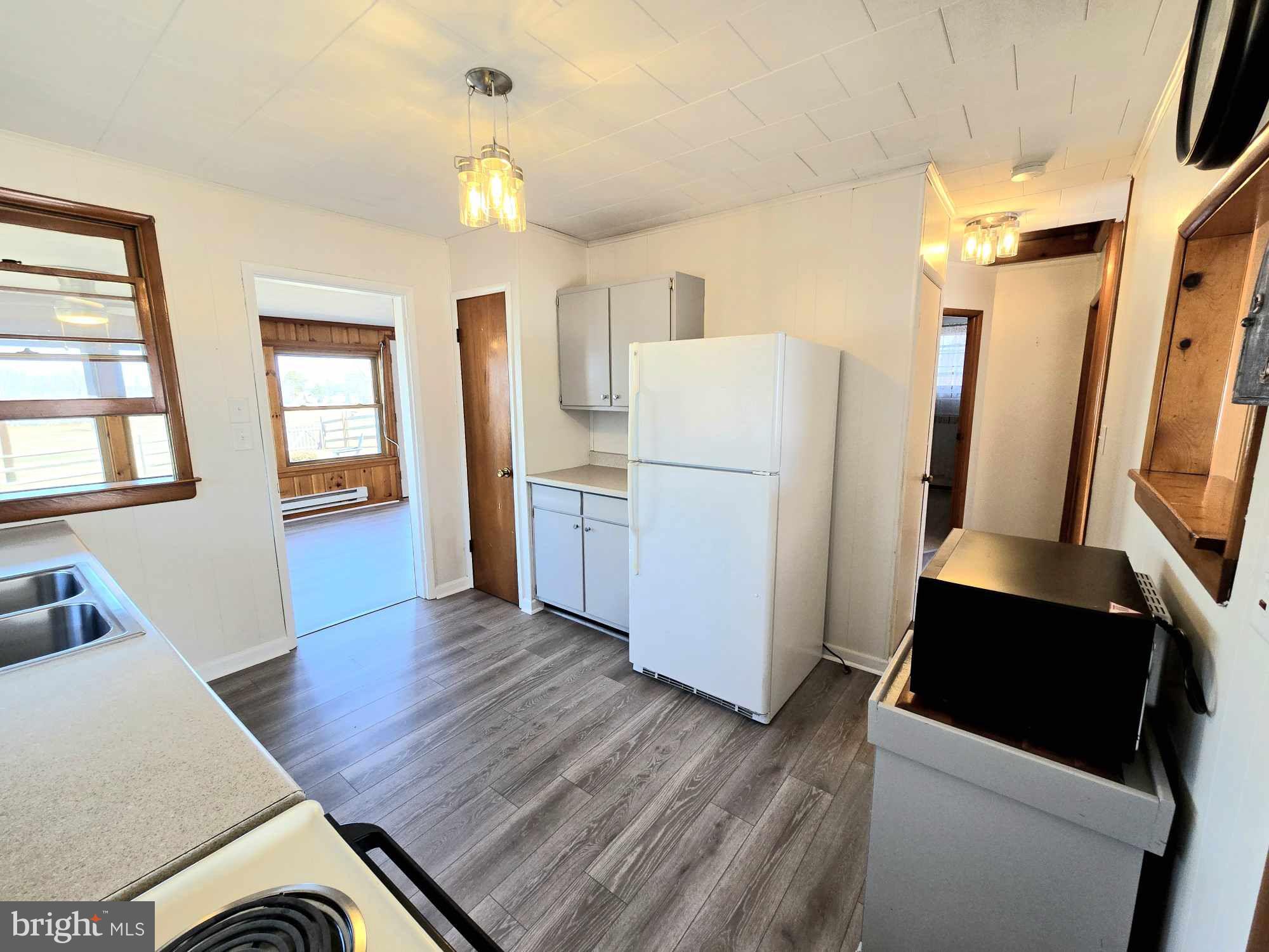 53 Circle Drive Earleville, MD 21919 - Photo 8 of 35 a room with wooden floors and white walls