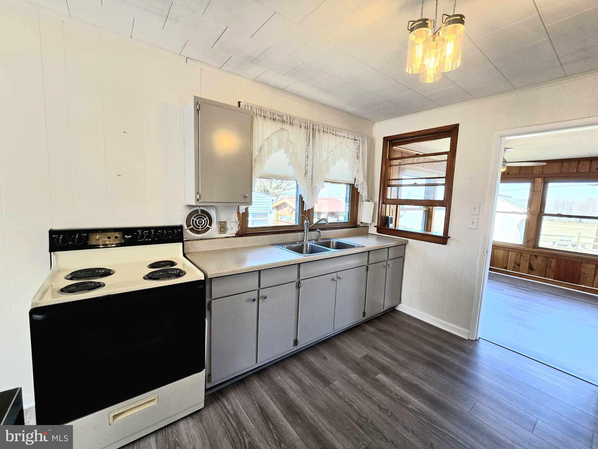 53 Circle Drive Earleville, MD 21919 - Photo 9 of 35 a kitchen with a sink stove and cabinets