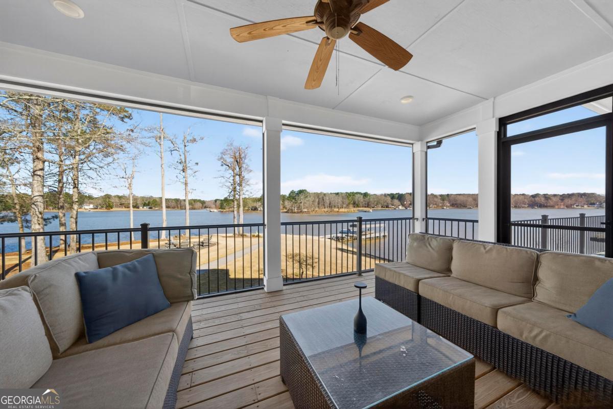 1010 Azalea Lane Buckhead, GA 30625 - Photo 17 of 67 a living room with furniture and a floor to ceiling window
