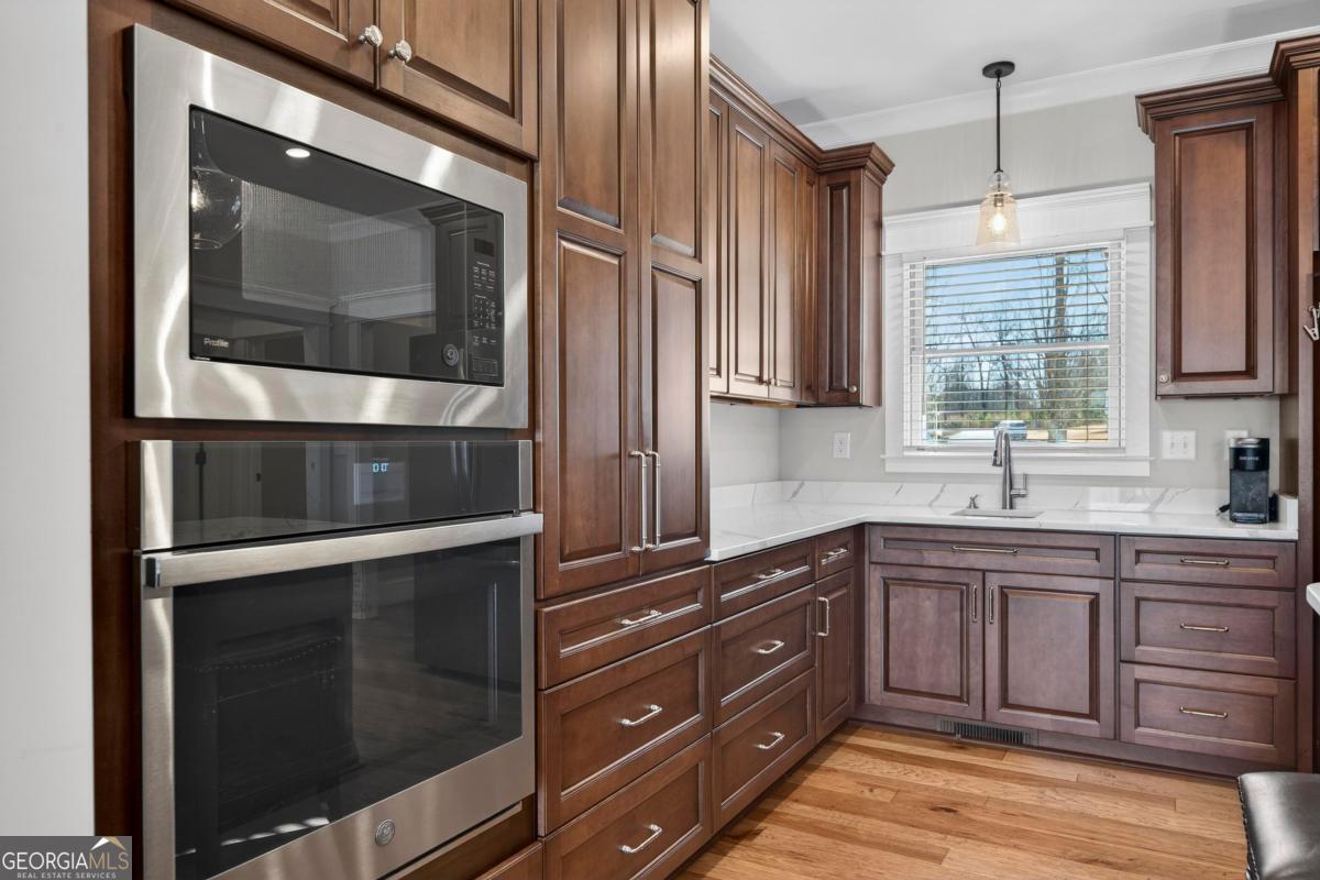 1010 Azalea Lane Buckhead, GA 30625 - Photo 24 of 67 a kitchen with a sink and a microwave