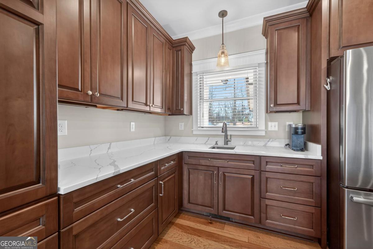 1010 Azalea Lane Buckhead, GA 30625 - Photo 26 of 67 a kitchen with stainless steel appliances granite countertop a sink window and cabinets