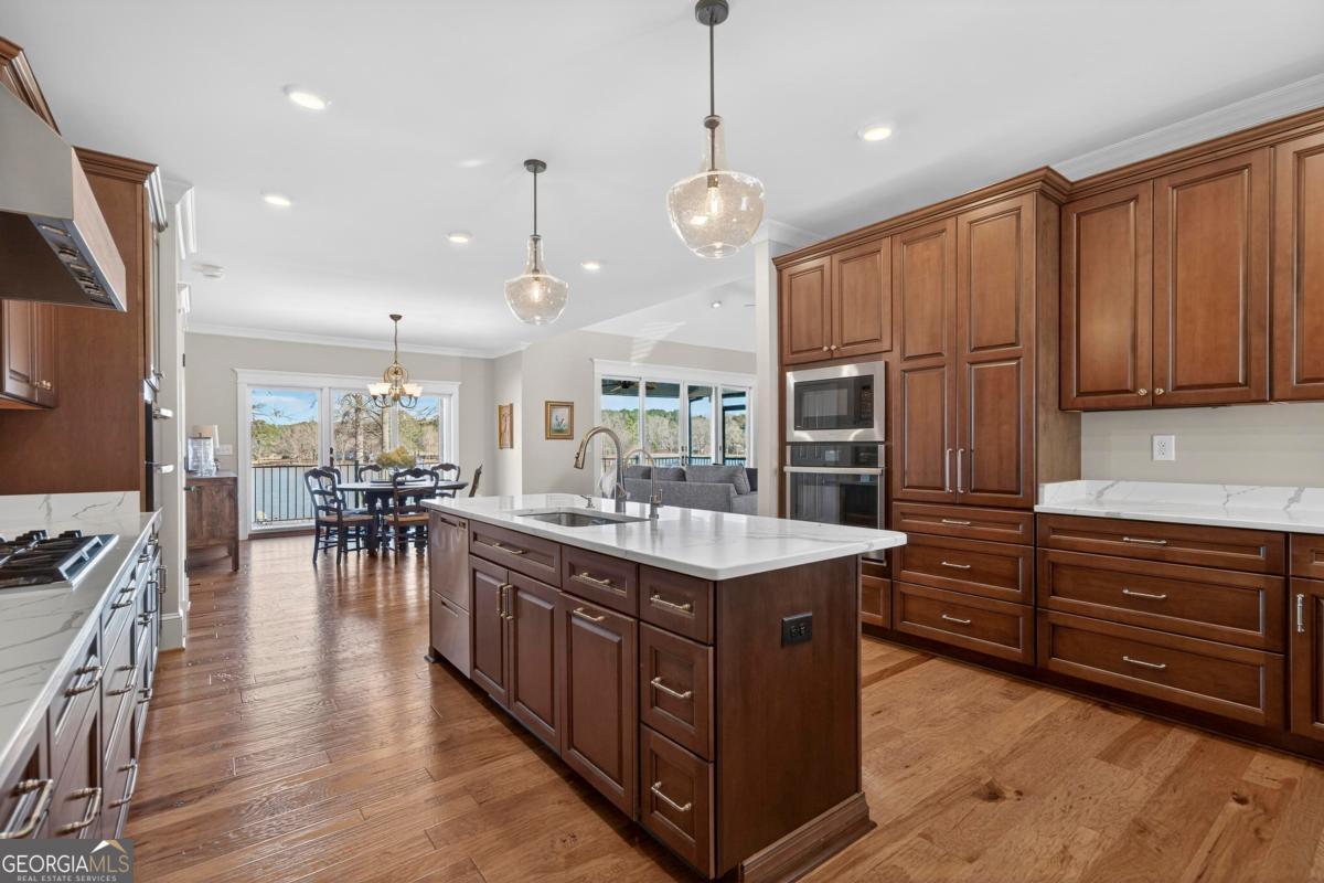 1010 Azalea Lane Buckhead, GA 30625 - Photo 27 of 67 a kitchen with stainless steel appliances granite countertop a stove oven and a refrigerator with cabinets
