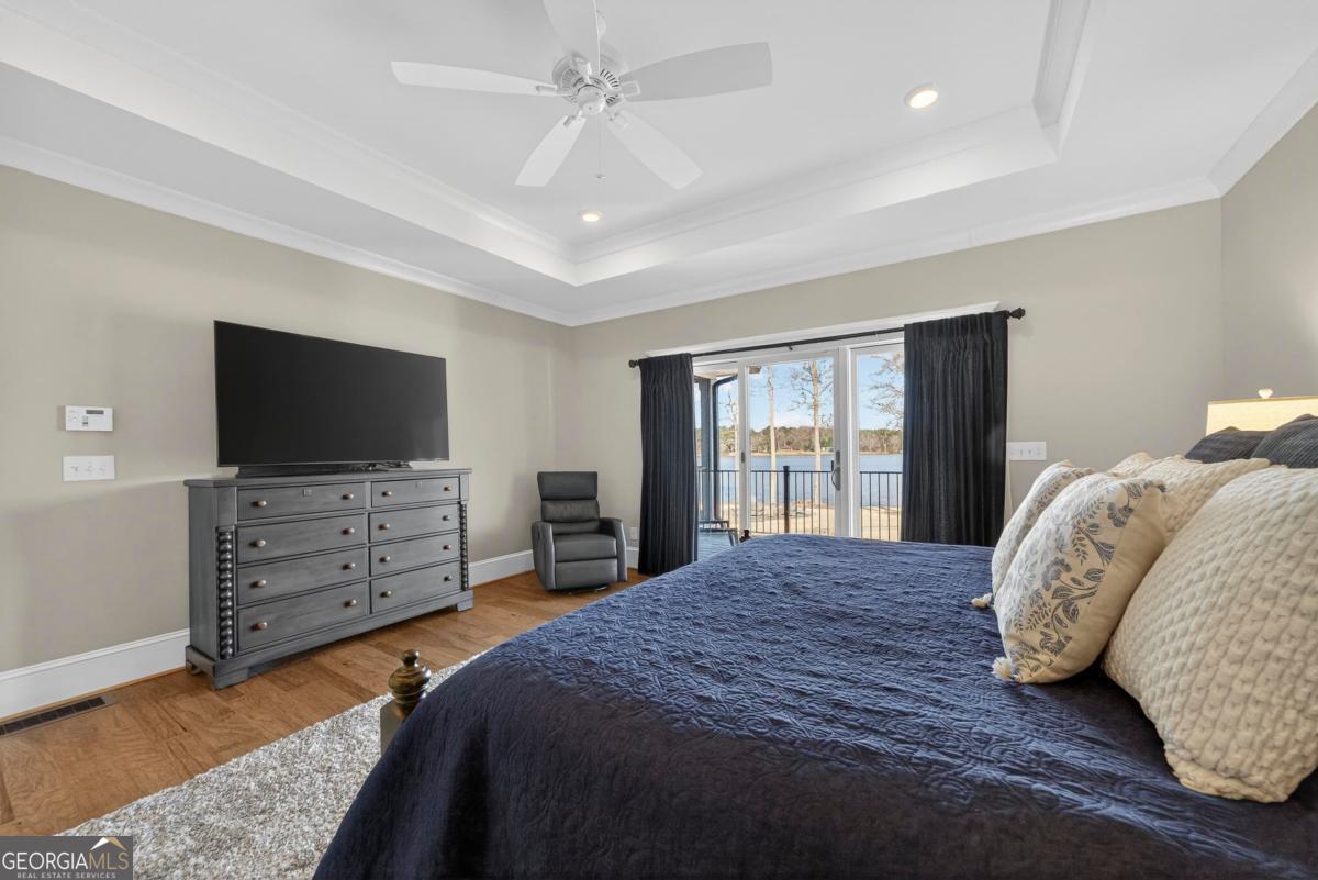 1010 Azalea Lane Buckhead, GA 30625 - Photo 29 of 67 a bedroom with a bed and flat screen tv