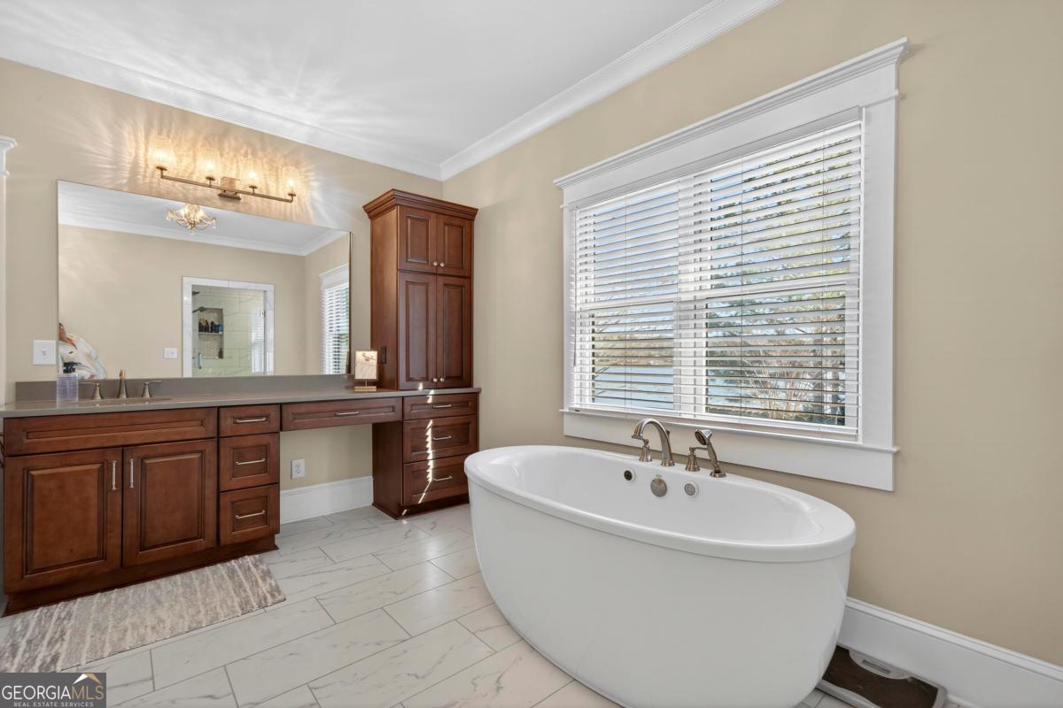 1010 Azalea Lane Buckhead, GA 30625 - Photo 30 of 67 a spacious bathroom with a tub sink and mirror
