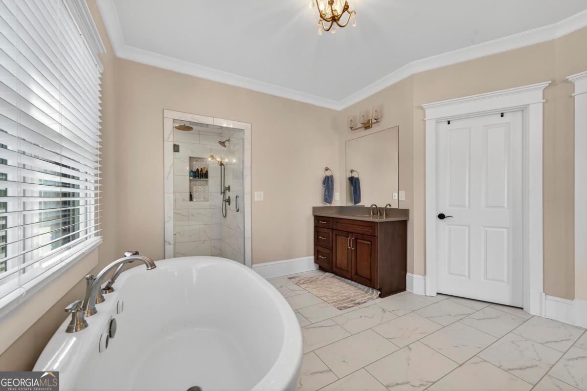 1010 Azalea Lane Buckhead, GA 30625 - Photo 31 of 67 a spacious bathroom with a tub sink and mirror