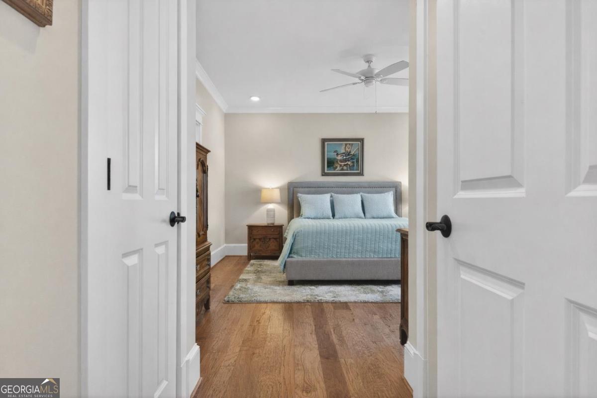 1010 Azalea Lane Buckhead, GA 30625 - Photo 32 of 67 a bedroom with a bed and a painting on the wall