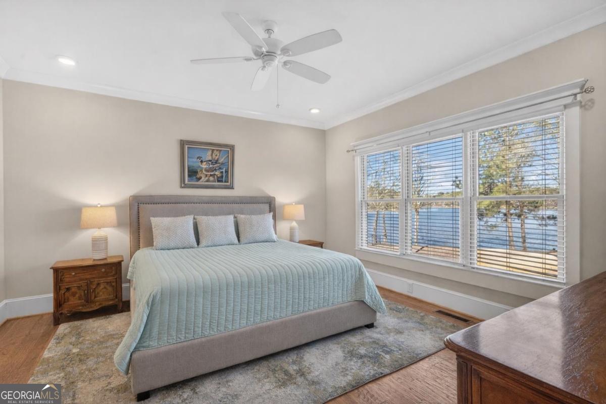 1010 Azalea Lane Buckhead, GA 30625 - Photo 33 of 67 a bedroom with a large bed and a large window