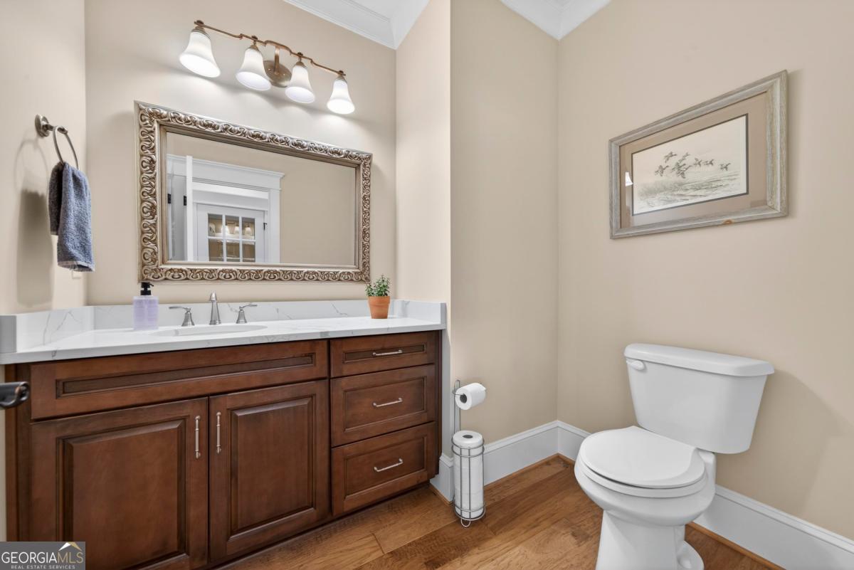 1010 Azalea Lane Buckhead, GA 30625 - Photo 38 of 67 a bathroom with a toilet sink and mirror