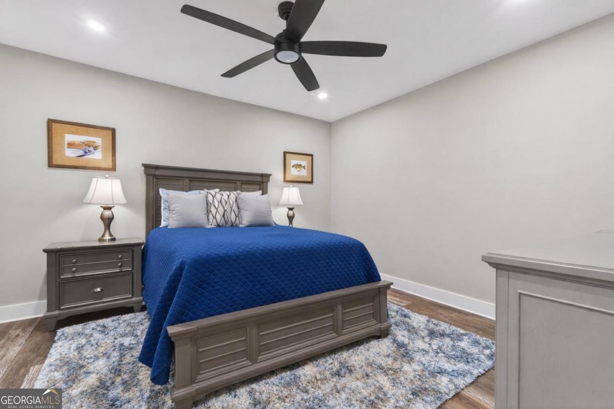 1010 Azalea Lane Buckhead, GA 30625 - Photo 45 of 67 a bedroom with a bed and a lamp on the dresser