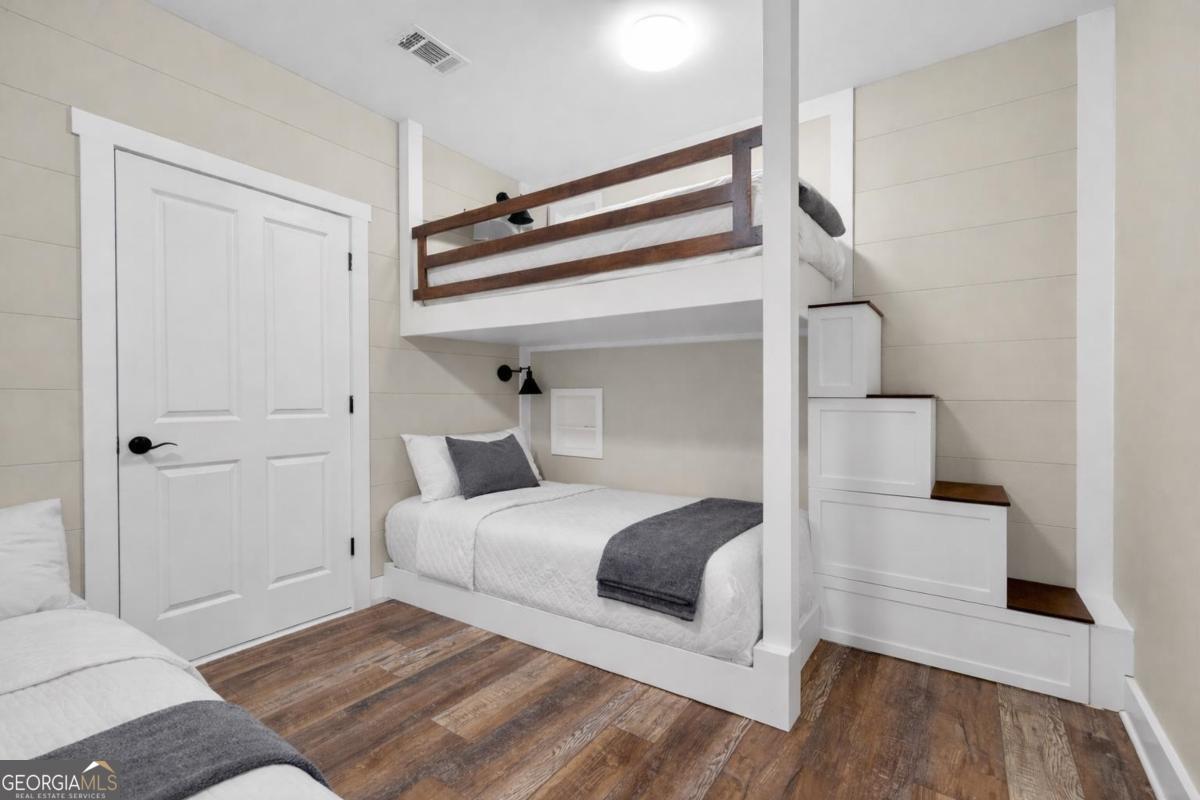 1010 Azalea Lane Buckhead, GA 30625 - Photo 48 of 67 a bedroom with a bed and a night stand