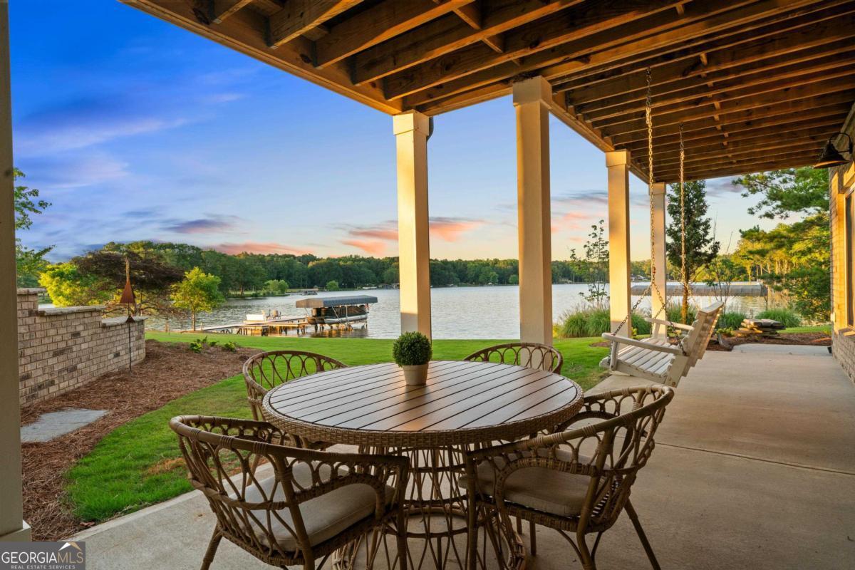1010 Azalea Lane Buckhead, GA 30625 - Photo 52 of 67 a view of swimming pool with a table and chairs in patio