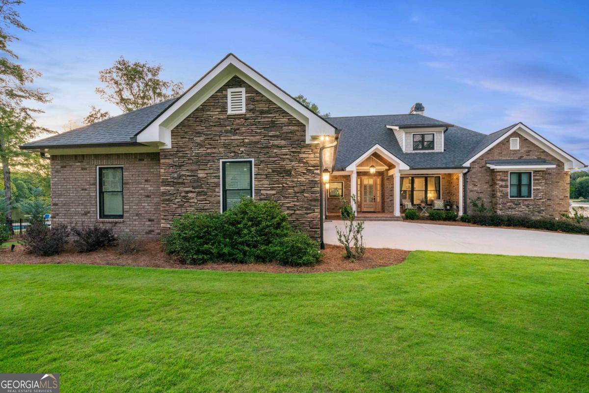 1010 Azalea Lane Buckhead, GA 30625 - Photo 7 of 67 a front view of a house with a yard and garage