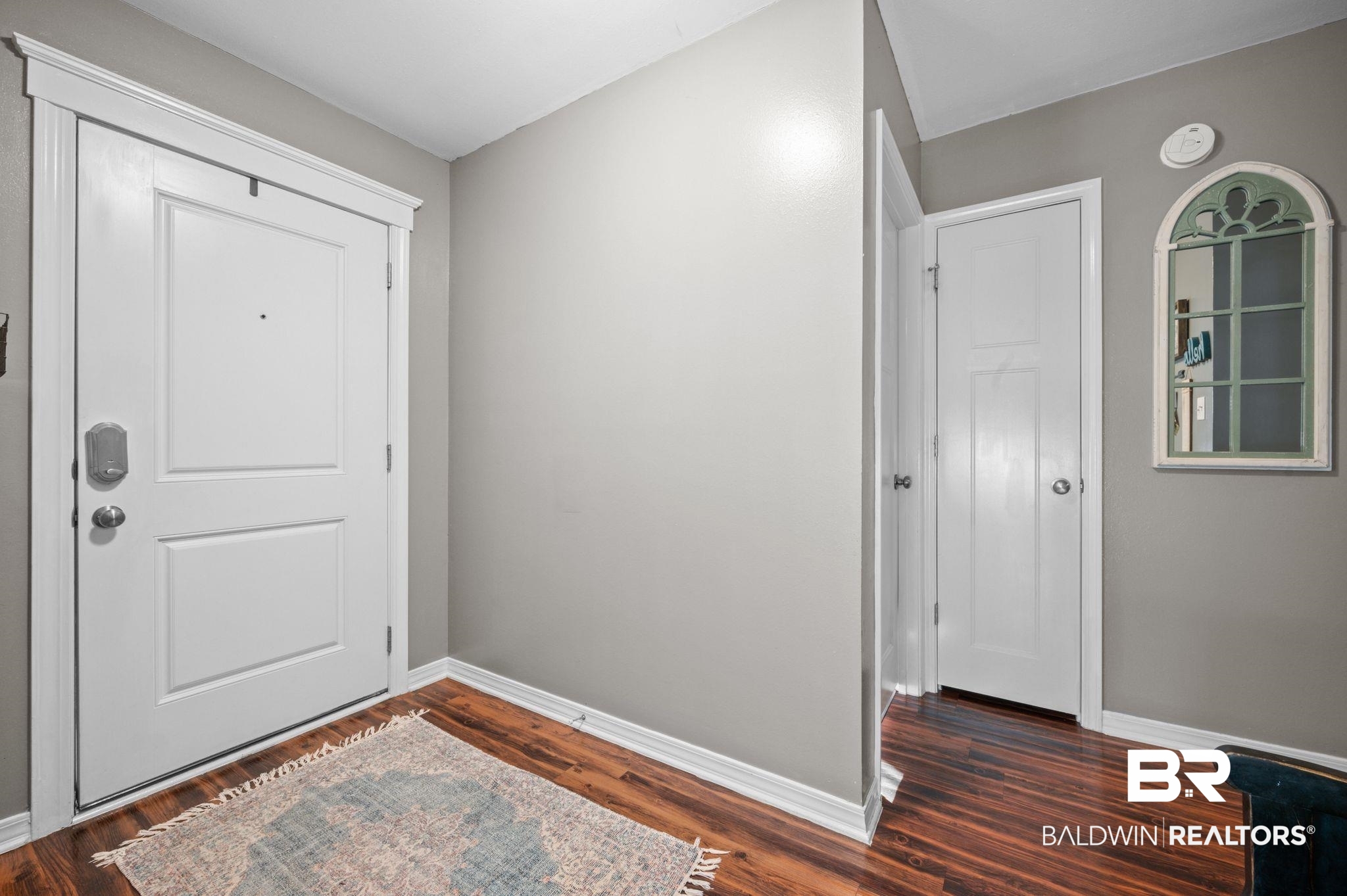 9366 Fox Run Court Semmes, AL 36575 - Photo 6 of 29 Entryway with dark wood-type flooring