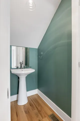 a bathroom with a sink and mirror