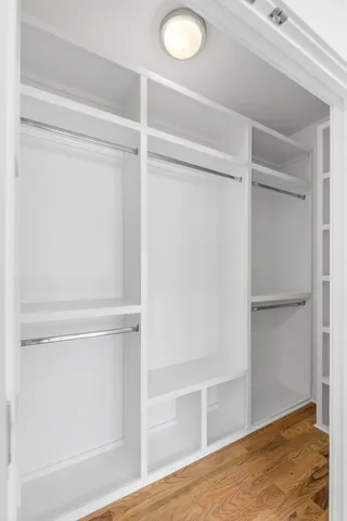 a view of an empty walk in closet