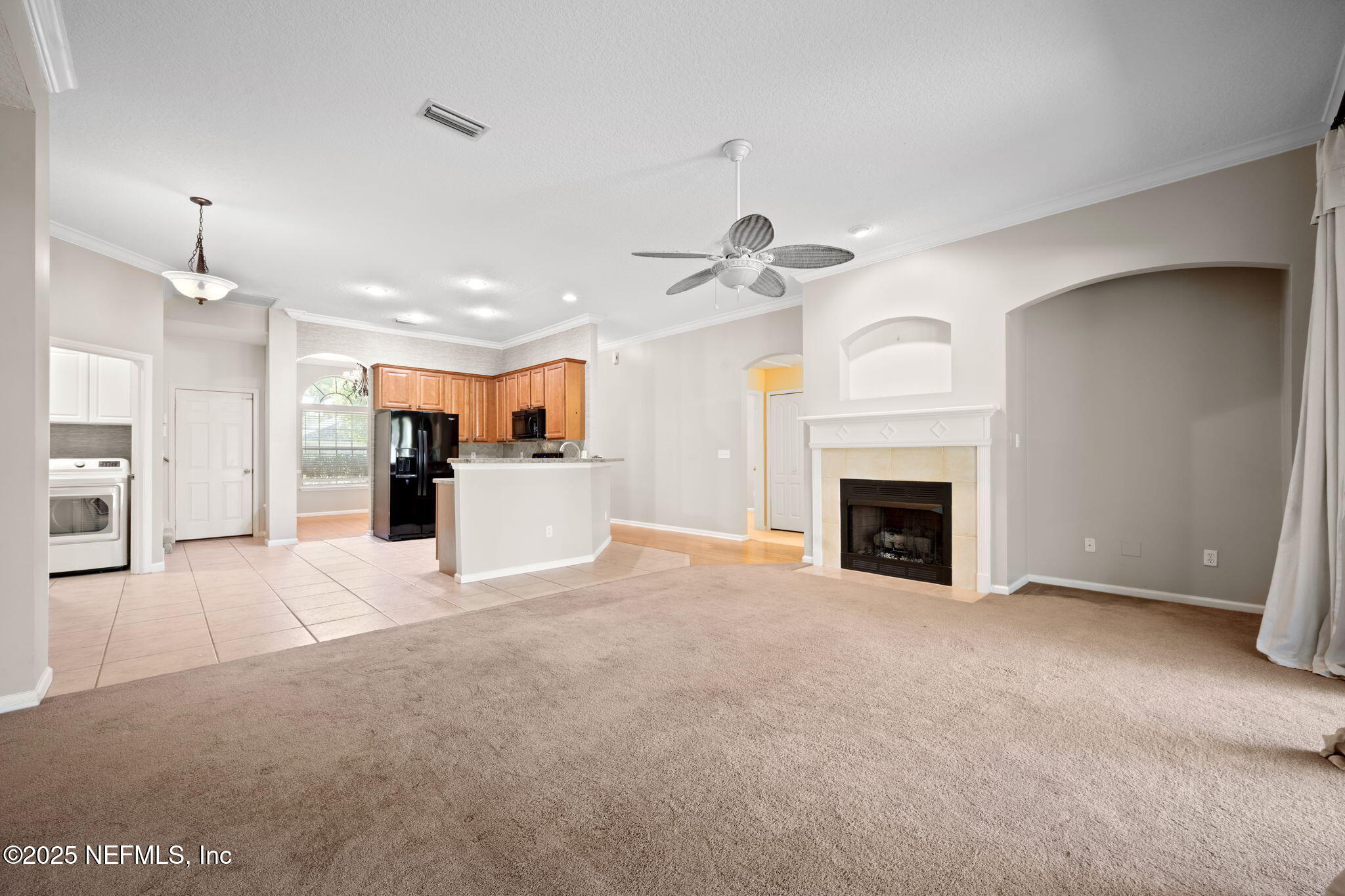 96316 Ridgewood Circle Fernandina Beach, FL 32034 - Photo 13 of 32 a view of a kitchen with a sink and a fireplace