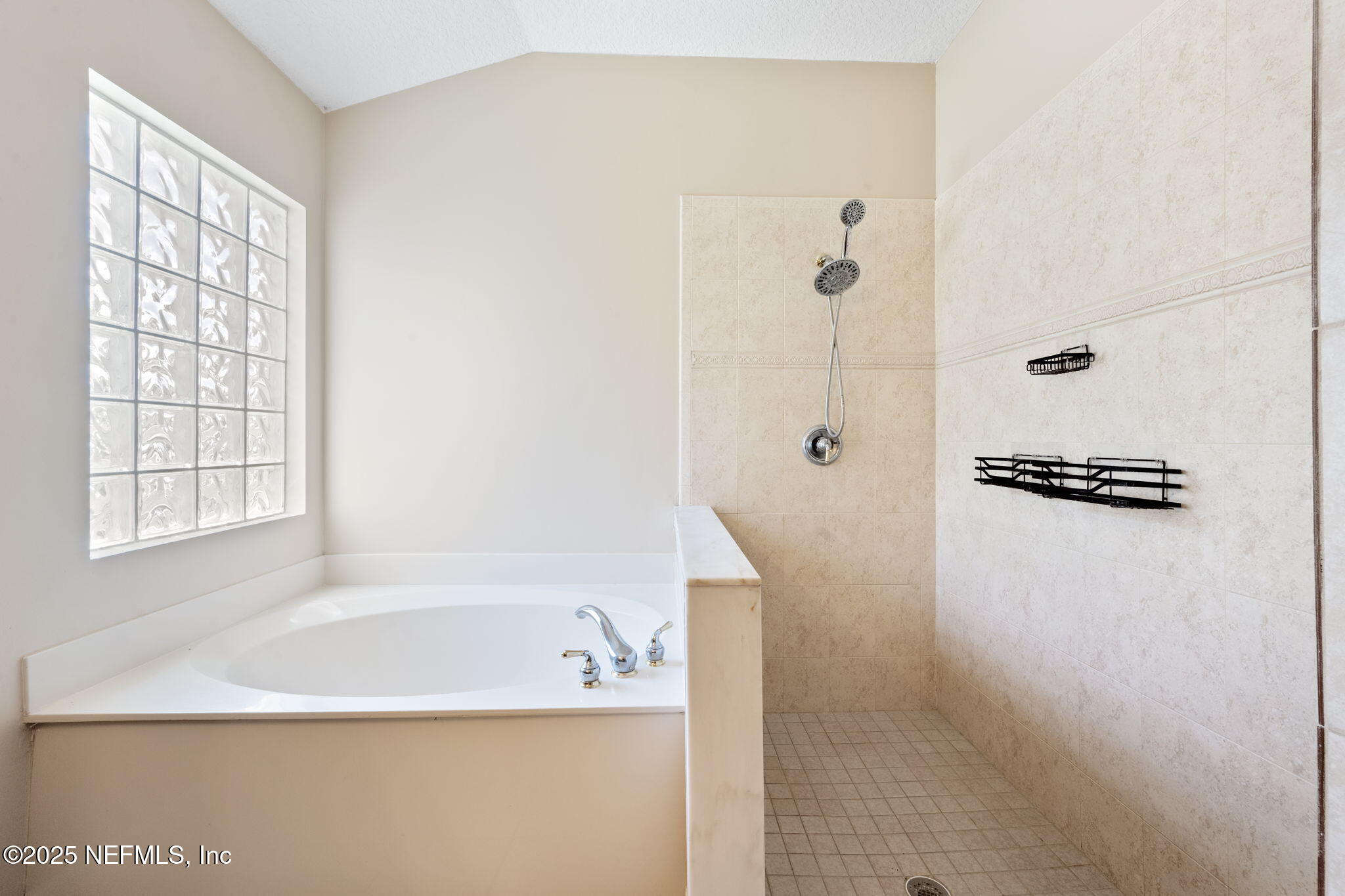 96316 Ridgewood Circle Fernandina Beach, FL 32034 - Photo 21 of 32 a bathroom with a bathtub and a shower