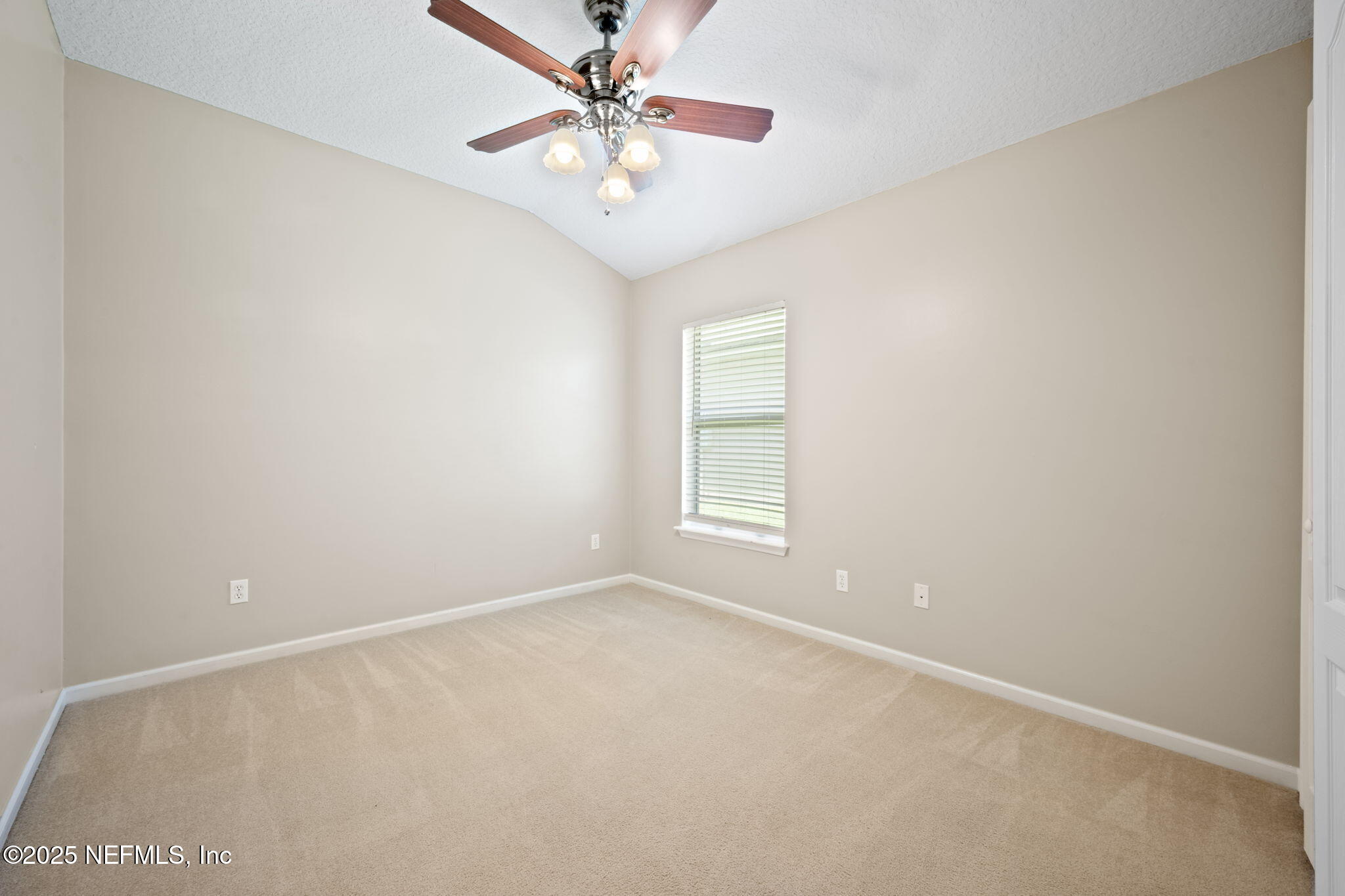 96316 Ridgewood Circle Fernandina Beach, FL 32034 - Photo 22 of 32 an empty room with a window and a fan