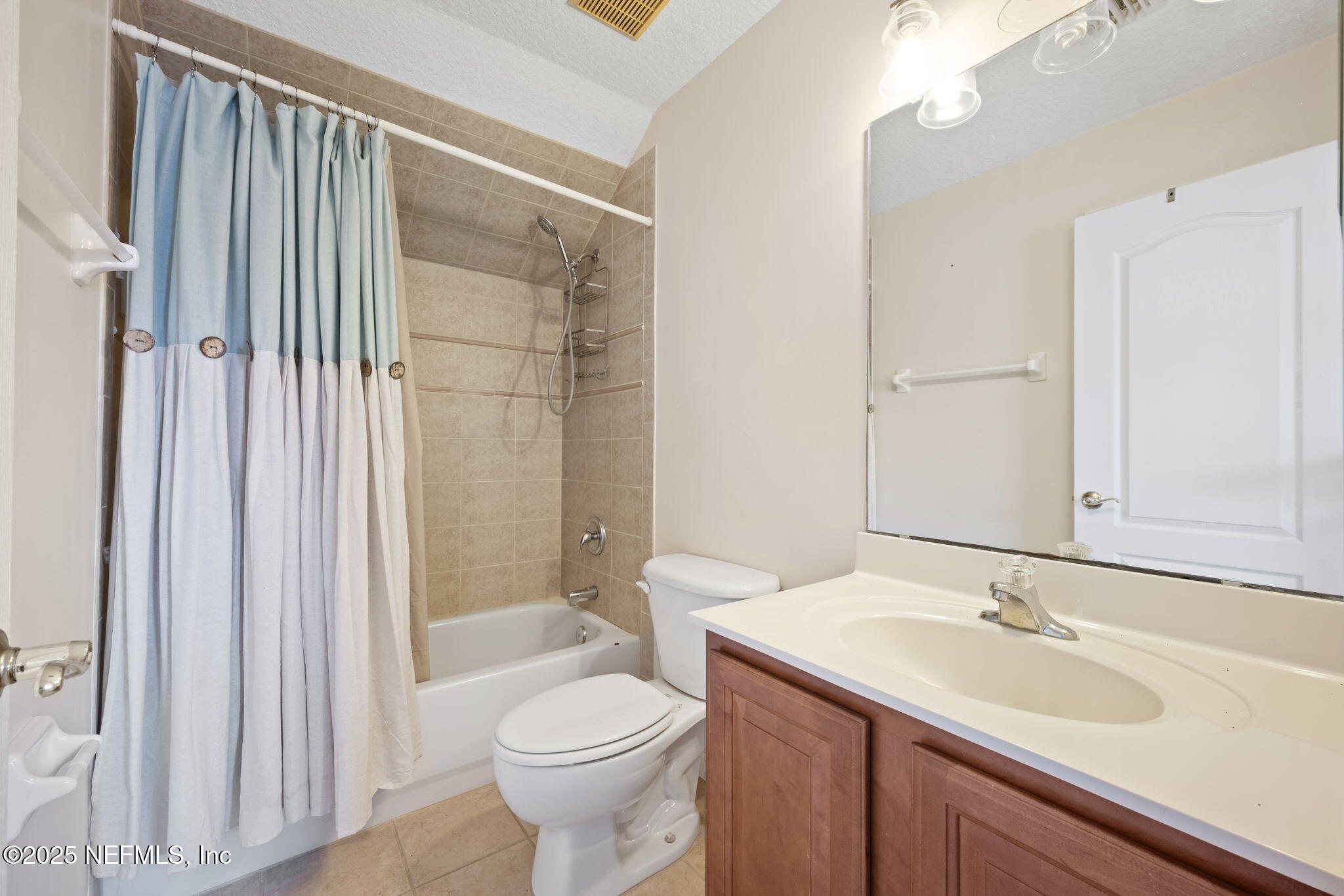 96316 Ridgewood Circle Fernandina Beach, FL 32034 - Photo 27 of 32 a bathroom with a sink a toilet and shower