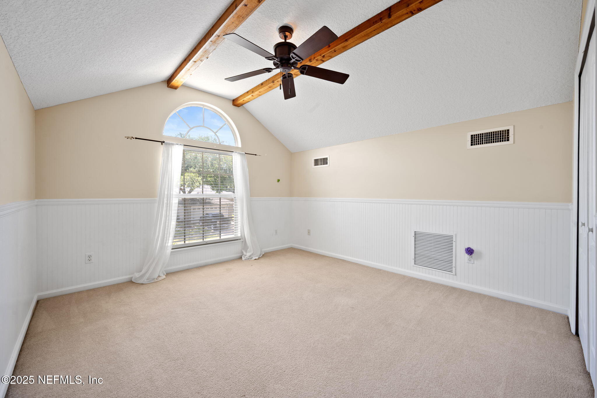 96316 Ridgewood Circle Fernandina Beach, FL 32034 - Photo 28 of 32 an empty room with fan and windows