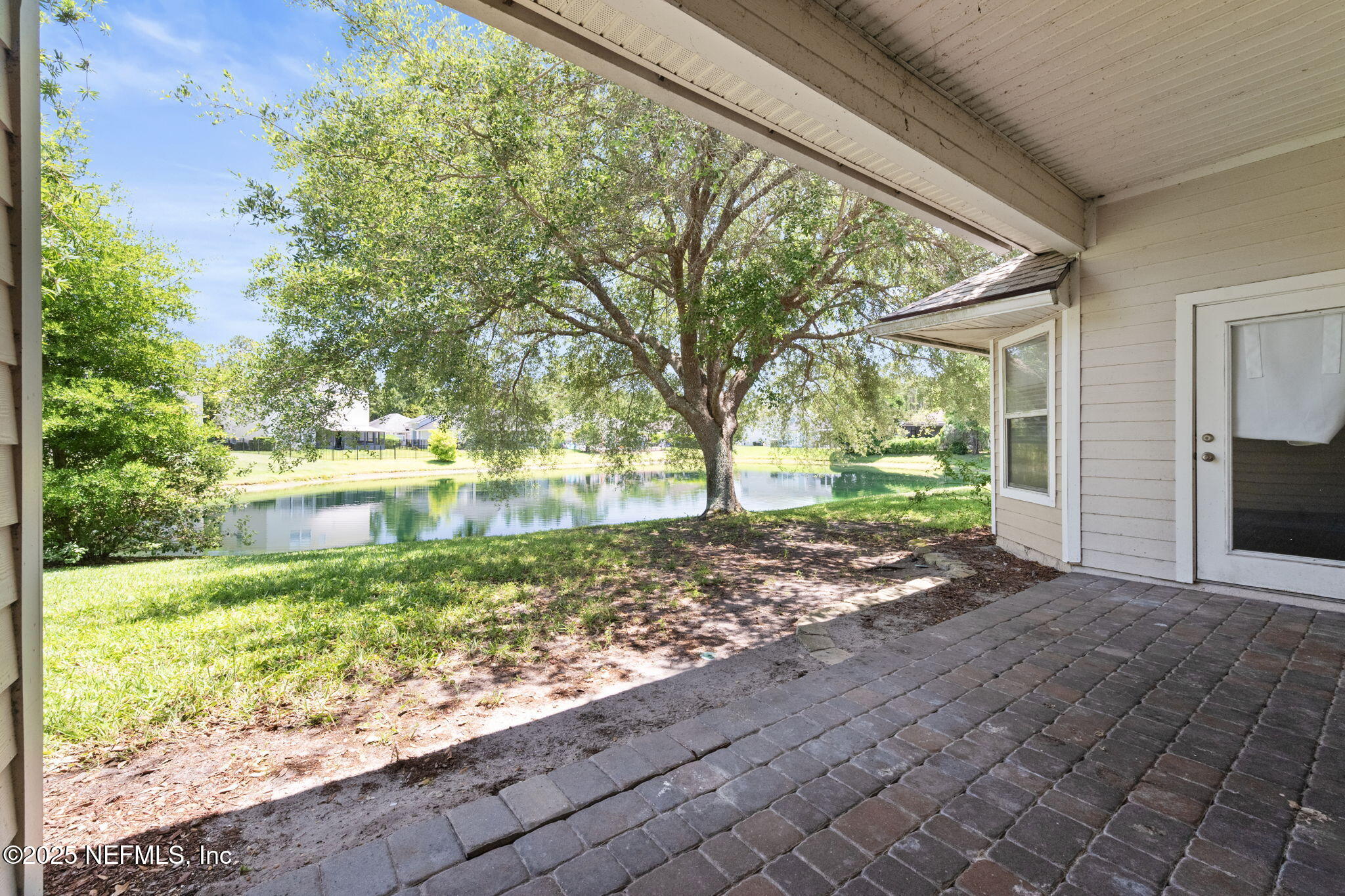 96316 Ridgewood Circle Fernandina Beach, FL 32034 - Photo 30 of 32 a view of a garden with plants and large trees